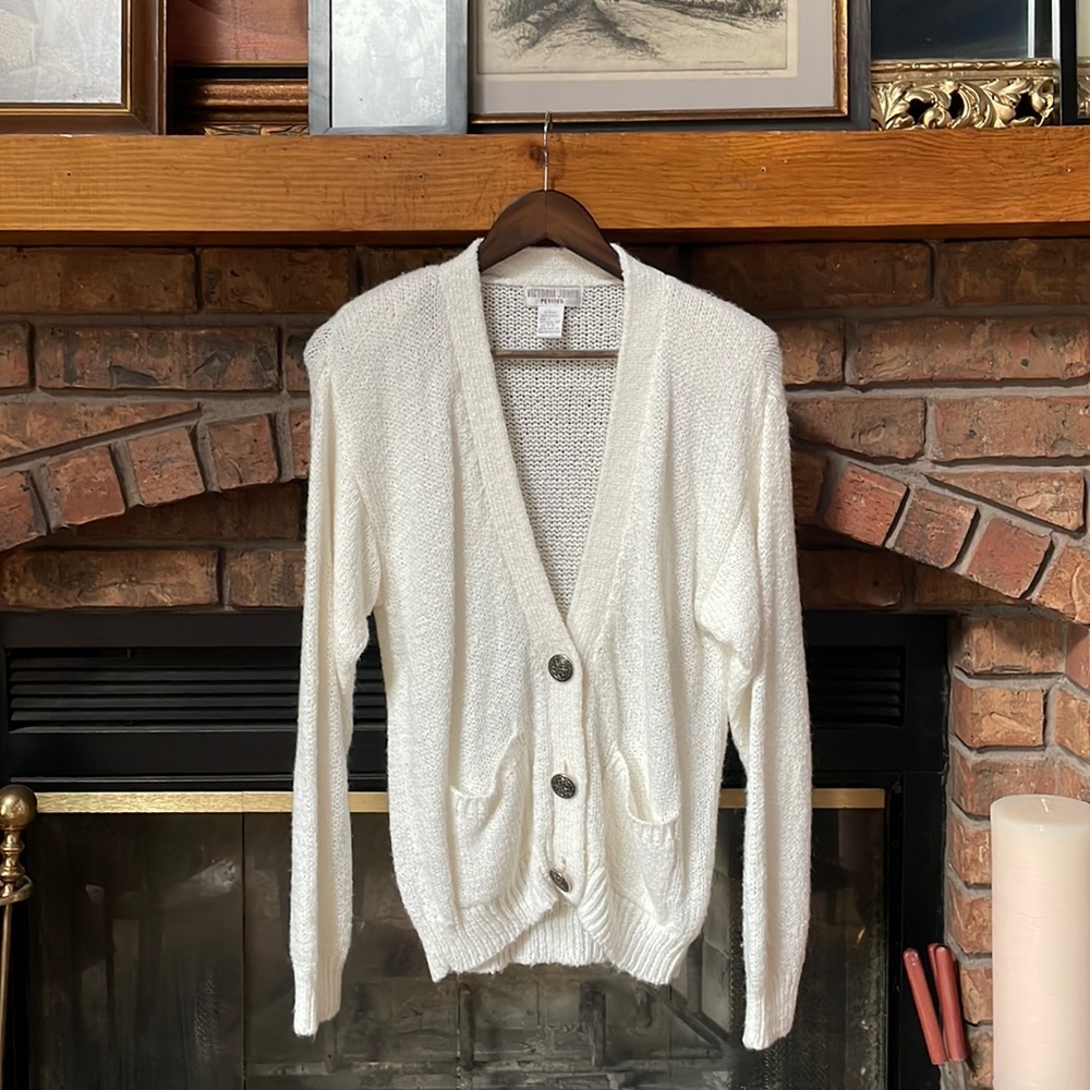 Cozy ivory knit cardigan. Soft, vintage with unique buttons.